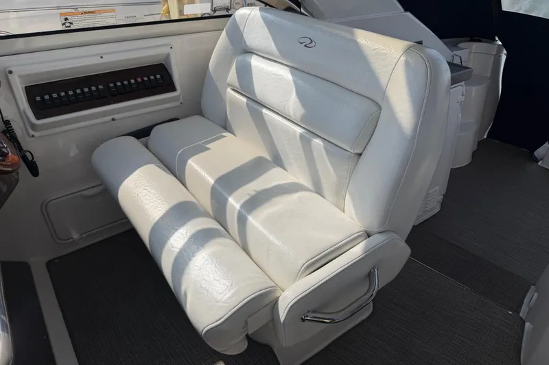 Slide: The Image of White leather seating in a 2007 Regal Commodore 3760 IO boat cockpit. - 17