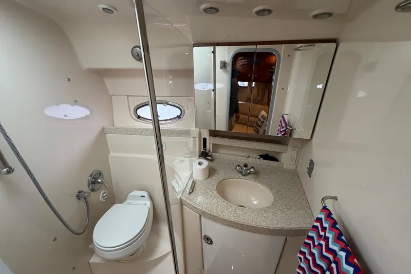 Slide: The Image of 2007 Regal Commodore 3760 IO bathroom with sink, toilet, mirror, and shower. - 35