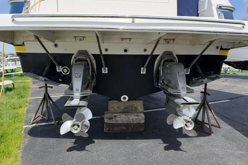 Slide: The Image of 2007 Regal Commodore 3760 IO boat stern with dual propellers on stands. - 55