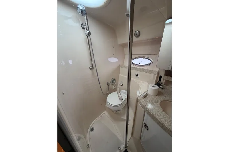 Slide: The Image of Bathroom interior of 2007 Regal Commodore 3760 IO yacht, featuring shower and toilet. - 37