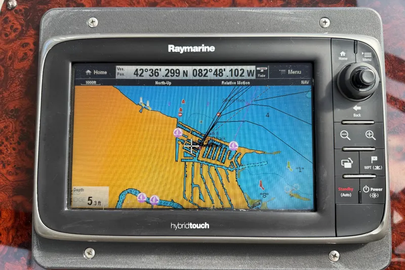 Slide: The Image of Raymarine GPS display on 2007 Regal Commodore 3760 IO, showing nautical chart and coordinates. - 21