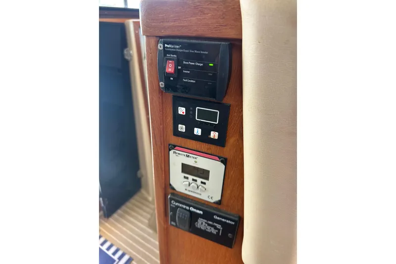 Slide: The Image of Control panel of a 2011 Ranger Tugs R-29 boat with various electronic displays. - 27