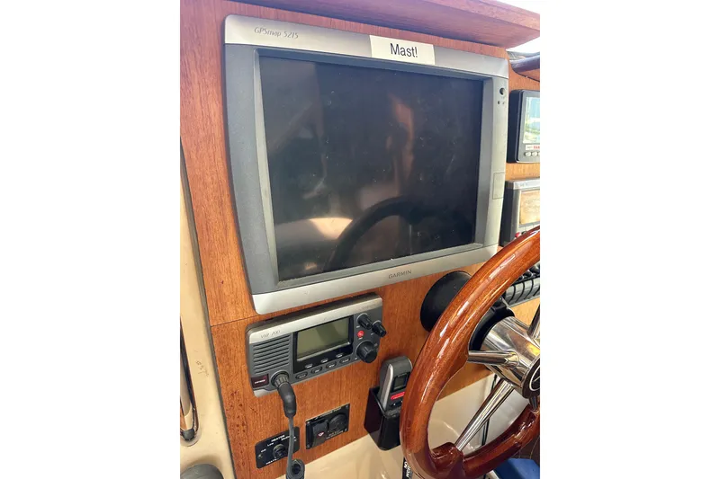 Slide: The Image of 2011 Ranger Tugs R-29 helm with Garmin GPSmap 5215 and VHF radio. - 23