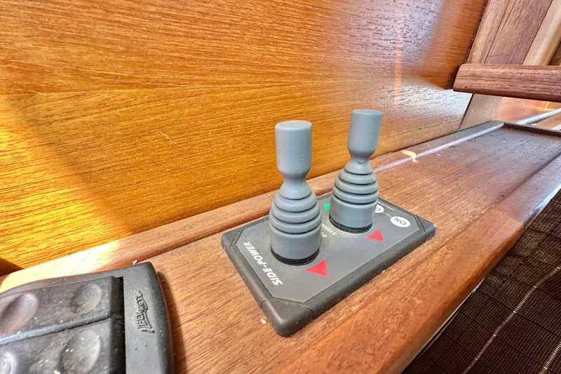 Slide: The Image of Control panel of a 2011 Ranger Tugs R-29 boat with dual levers. - 22