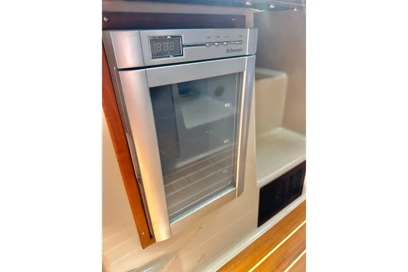 Slide: The Image of Stainless steel Dometic refrigerator in 2011 Ranger Tugs R-29 boat interior. - 25