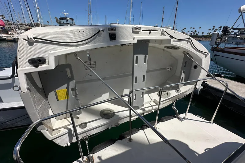 Slide: The Image of 2011 Ranger Tugs R-29 boat stern view at marina with open hatch. - 31