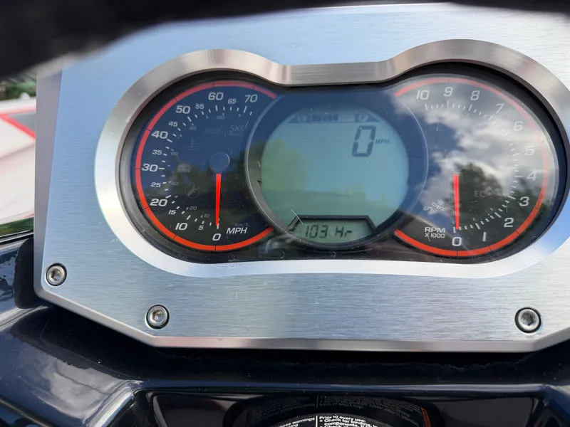 Slide: The Image of The image shows the dashboard of a 2017 Scarab 165 with a speedometer and tachometer. - 10