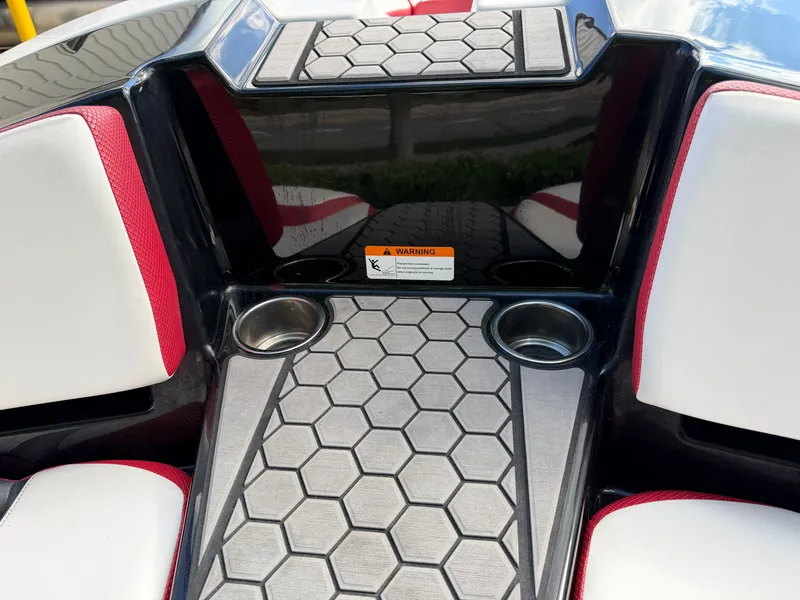 Slide: The Image of Close-up of a 2017 Scarab 165 cockpit with honeycomb pattern and cup holders. - 5