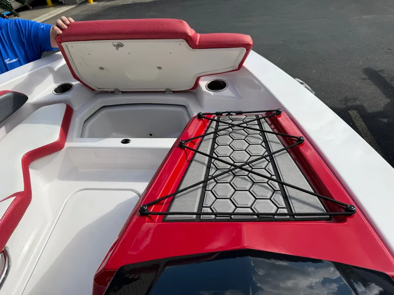 Slide: The Image of The image shows the deck of a 2017 Scarab 165 boat with storage and red accents. - 15