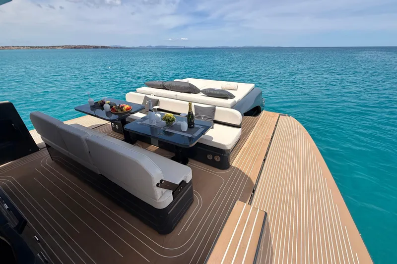 Slide: The Image of Luxurious 2026 Kumbra 43 yacht deck with elegant seating and ocean view. - 13