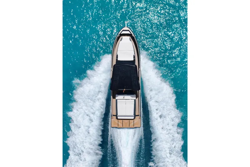 Slide: The Image of Aerial view of 2026 Kumbra 43 yacht cruising on turquoise water. - 5