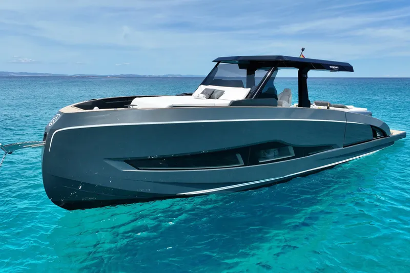 The Image of Luxury Kumbra 43 yacht, 2026 model, floating on clear turquoise water under a blue sky. - 6