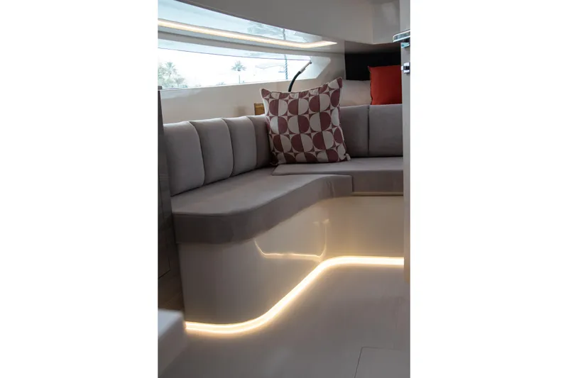 Slide: The Image of Luxurious interior of 2026 Kumbra 43 yacht with modern seating and ambient lighting. - 20