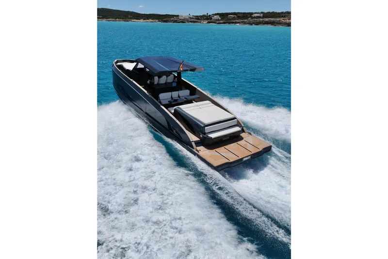 Slide: The Image of Luxury Kumbra 43 yacht cruising in clear blue waters, 2026 model. - 2