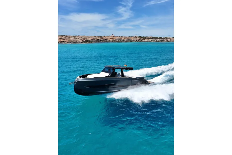 Slide: The Image of Modern Kumbra 43 yacht cruising in clear blue waters, 2026 model. - 3