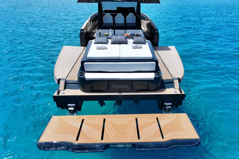 Slide: The Image of Luxury Kumbra 43 yacht, 2026 model, with elegant deck and sunbeds on clear blue water. - 8