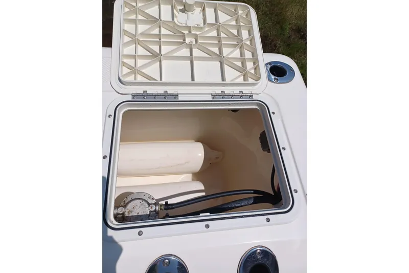 Slide: The Image of Open storage compartment on a 2006 Key West 176 Sportsman CC boat. - 11