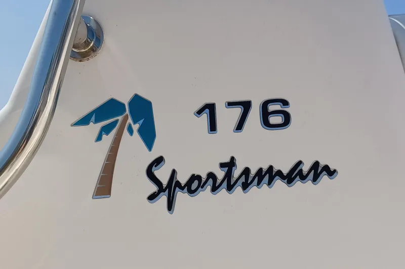 Slide: The Image of Key West 176 Sportsman CC 2006 boat logo with palm tree design. - 13