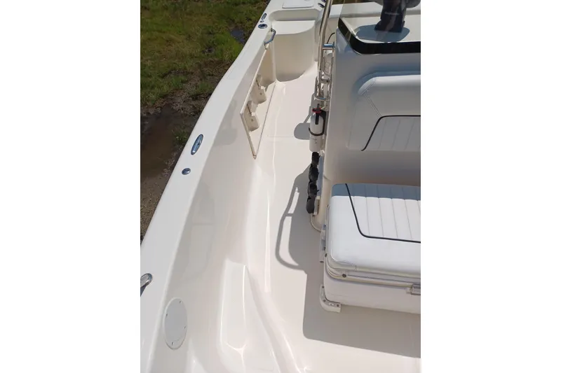 Slide: The Image of 2006 Key West 176 Sportsman CC boat interior with seating and storage compartments. - 8