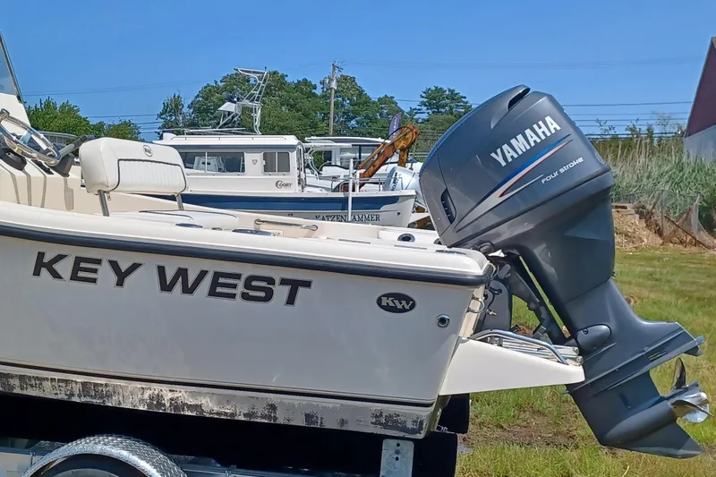 Slide: The Image of 2006 Key West 176 Sportsman CC boat with Yamaha outboard motor, parked on a trailer. - 12