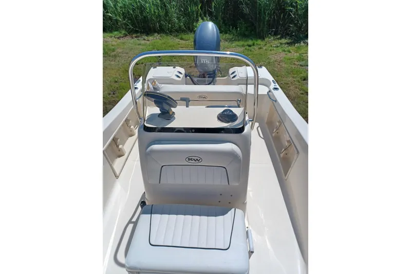 Slide: The Image of 2006 Key West 176 Sportsman CC boat interior with steering console and seating. - 7