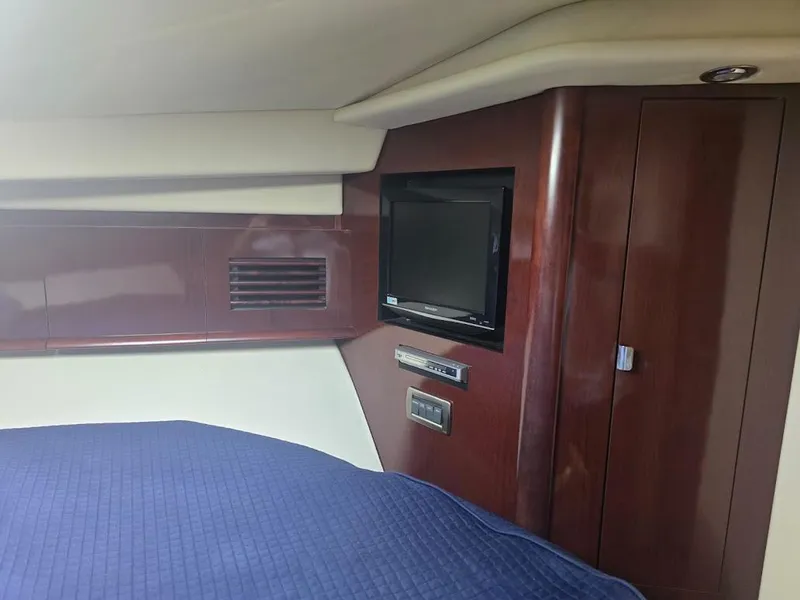 Slide: The Image of Interior of 2008 Sea Ray 40 Sundancer with TV and wood paneling. - 21