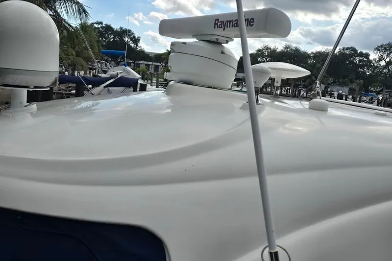 Slide: The Image of 2008 Sea Ray 40 Sundancer yacht with Raymarine radar, docked under cloudy sky. - 5