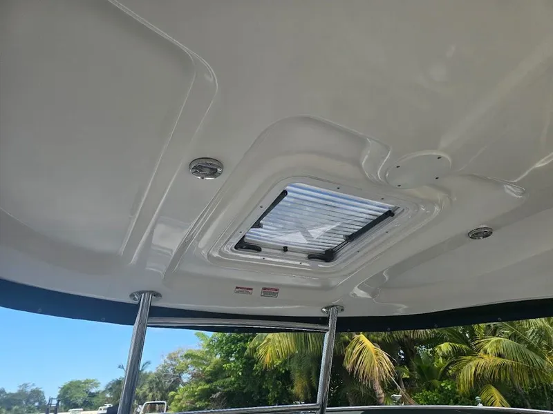 Slide: The Image of Ceiling view of 2008 Sea Ray 40 Sundancer boat with hatch and tropical background. - 12