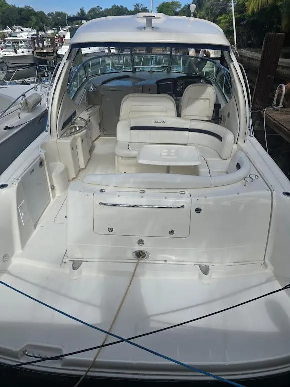 Slide: The Image of 2008 Sea Ray 40 Sundancer yacht with spacious cockpit and seating area at dock. - 7