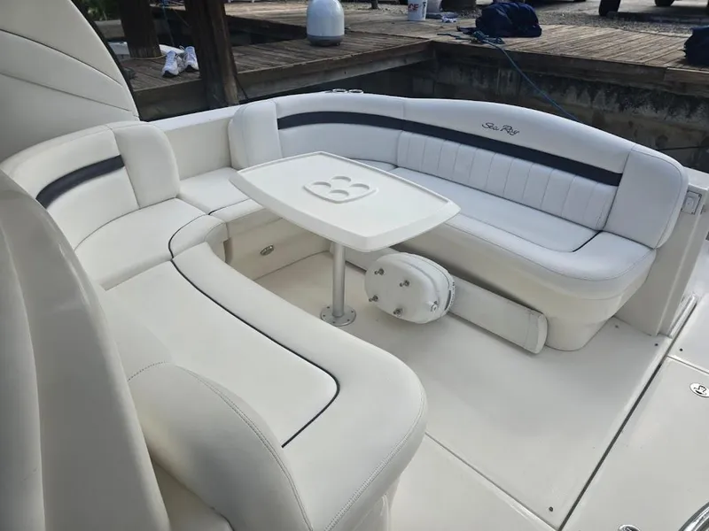 Slide: The Image of 2008 Sea Ray 40 Sundancer boat interior with white seating and table. - 8