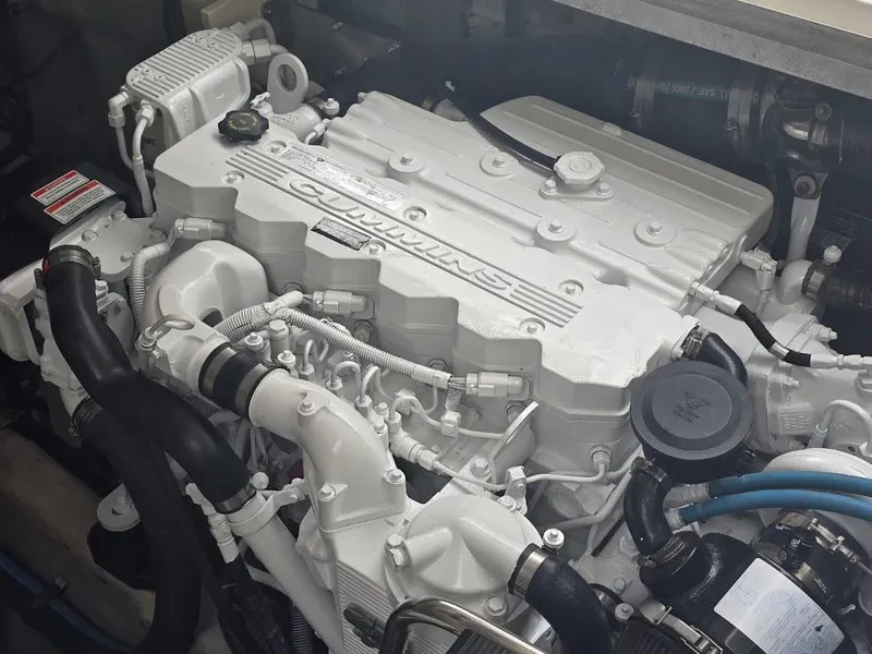 Slide: The Image of Engine of a 2008 Sea Ray 40 Sundancer boat, featuring Cummins branding. - 26