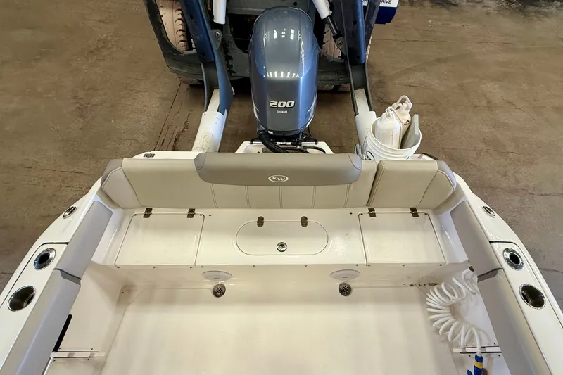 Slide: The Image of The image shows the stern of a Key West 219 FS boat with a 200 HP outboard motor. - 29