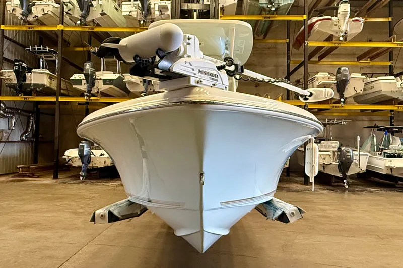 Slide: The Image of A 2023 Key West 219 FS boat is in a warehouse, resting on a trailer. - 5