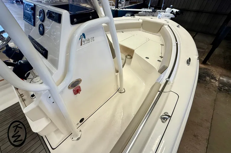 Slide: The Image of The image shows the deck of a 2023 Key West 219 FS boat with a helm console. - 17
