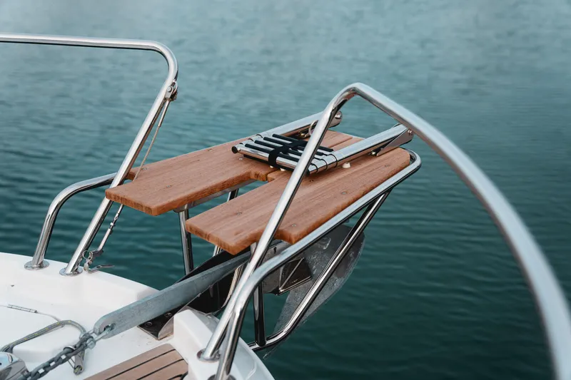 Slide: The Image of Beneteau Antares 9 V2 2026 bow with wooden platform over water. - 14