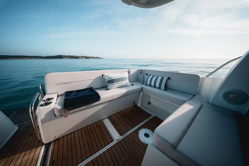 Slide: The Image of 2026 Beneteau Antares 9 V2 boat deck with cushioned seating, ocean view. - 17