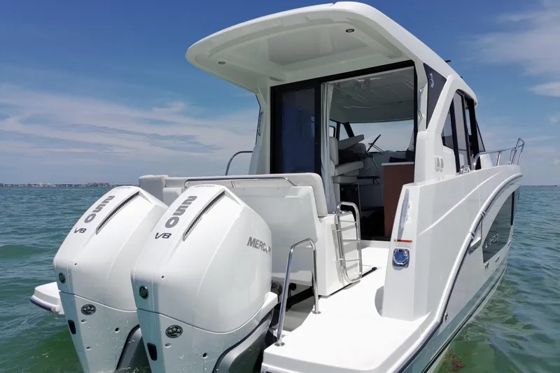 Slide: The Image of 2026 Beneteau Antares 9 V2 boat with dual Mercury outboard engines on open water. - 11
