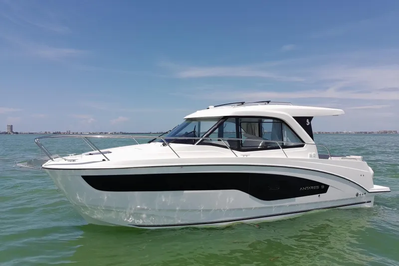 Slide: The Image of 2026 Beneteau Antares 9 V2 boat on calm sea under clear sky. - 6