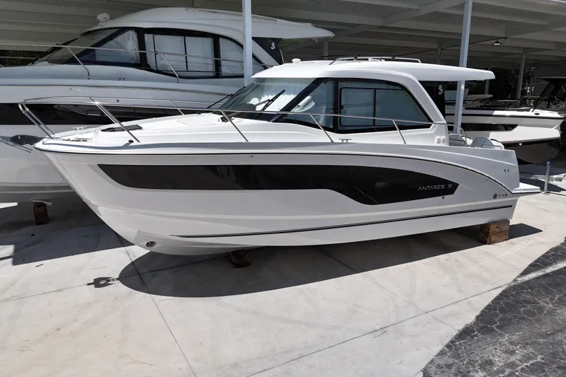 Slide: The Image of 2026 Beneteau Antares 9 V2 boat displayed in a showroom, side view. - 1