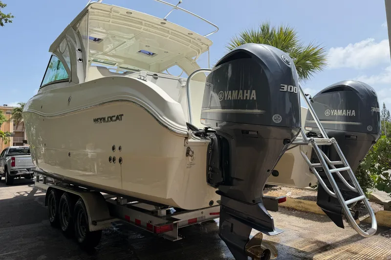 Slide: The Image of 2019 World Cat 320 DC boat with dual Yamaha 300 engines on a trailer. - 6
