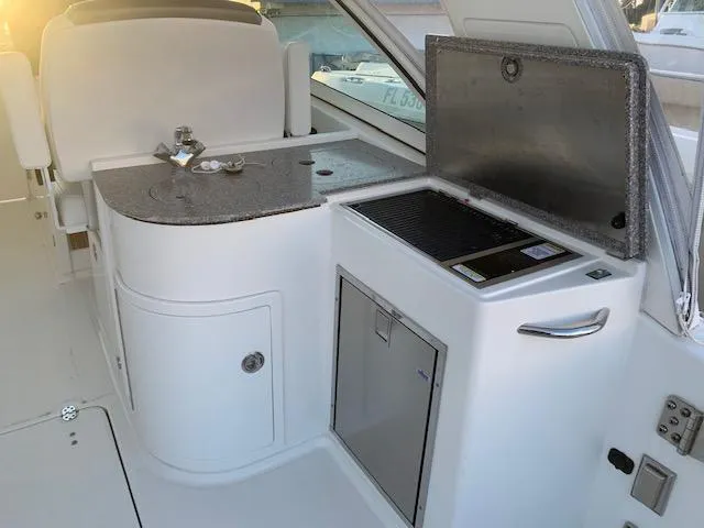 Slide: The Image of The 2019 World Cat 320 DC features a well-equipped onboard kitchen with a sink and grill. - 26