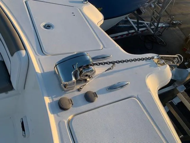 Slide: The Image of The image shows the deck of a 2019 World Cat 320 DC with an anchor windlass. - 16