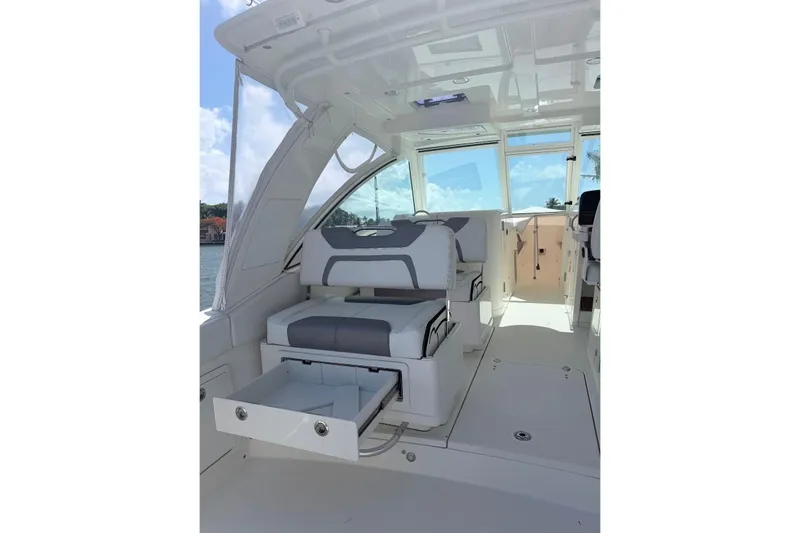 Slide: The Image of 2019 World Cat 320 DC interior with seating and storage drawer open. - 24