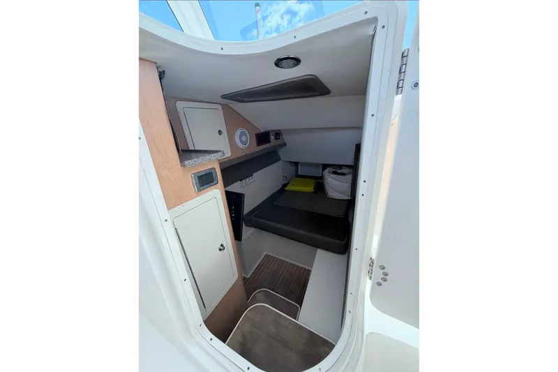 Slide: The Image of 2019 World Cat 320 DC cabin interior with seating and storage compartments. - 20