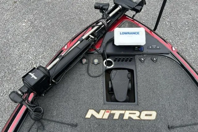 Slide: The Image of 2024 Nitro Z19 boat deck with Lowrance electronics and trolling motor. - 2