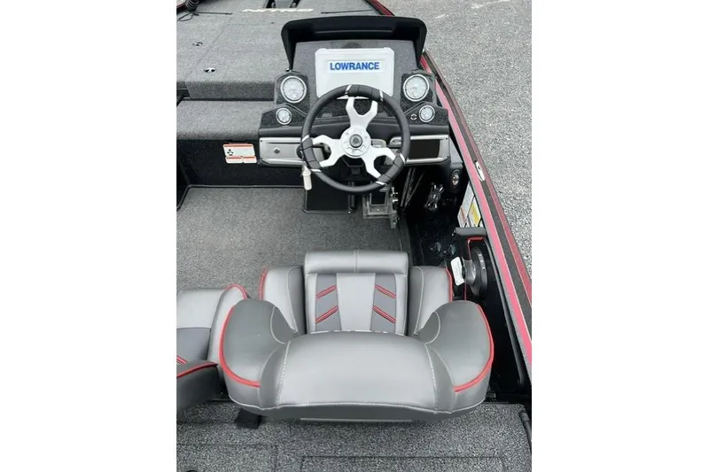 Slide: The Image of 2024 Nitro Z19 boat cockpit with steering wheel and Lowrance display. - 4