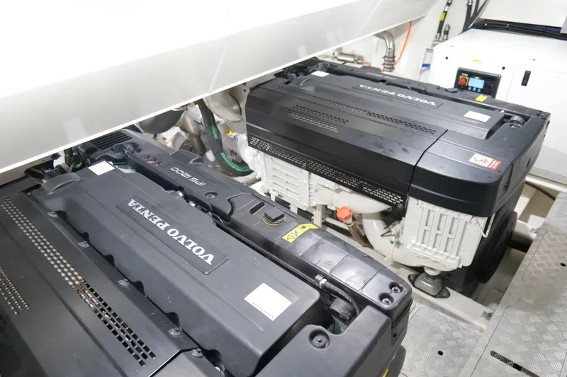 Slide: The Image of Engine room of 2022 Pearl 62 yacht featuring Volvo Penta engines. - 66