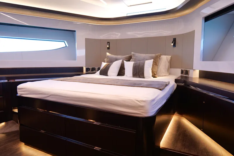 Slide: The Image of Luxurious bedroom interior of 2022 Pearl 62 yacht with modern design and ambient lighting. - 33