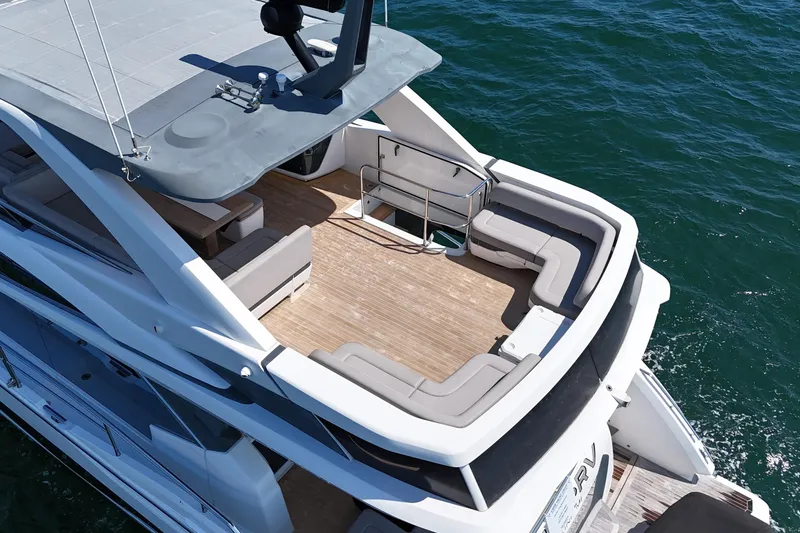 Slide: The Image of Aerial view of 2022 Pearl 62 yacht's spacious deck on the ocean. - 54