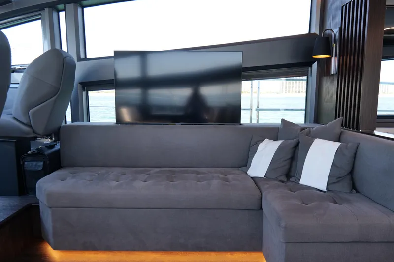 Slide: The Image of Luxurious interior of 2022 Pearl 62 yacht with plush seating and modern decor. - 17